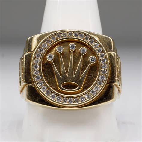 18k gold rolex ring.